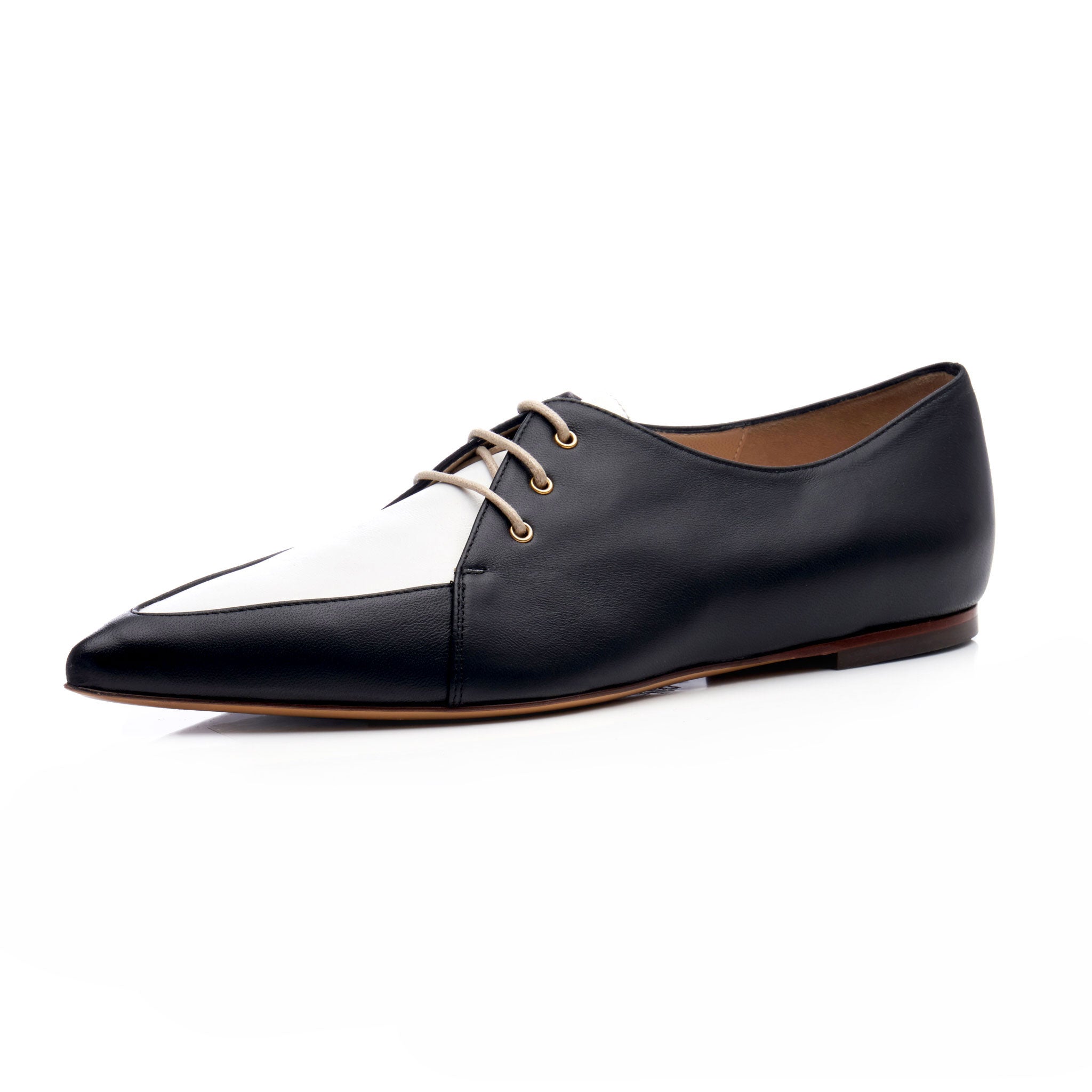 women's lace up spectators with black and white upper and elongated pointed toe with brown leather sole and tan round laces