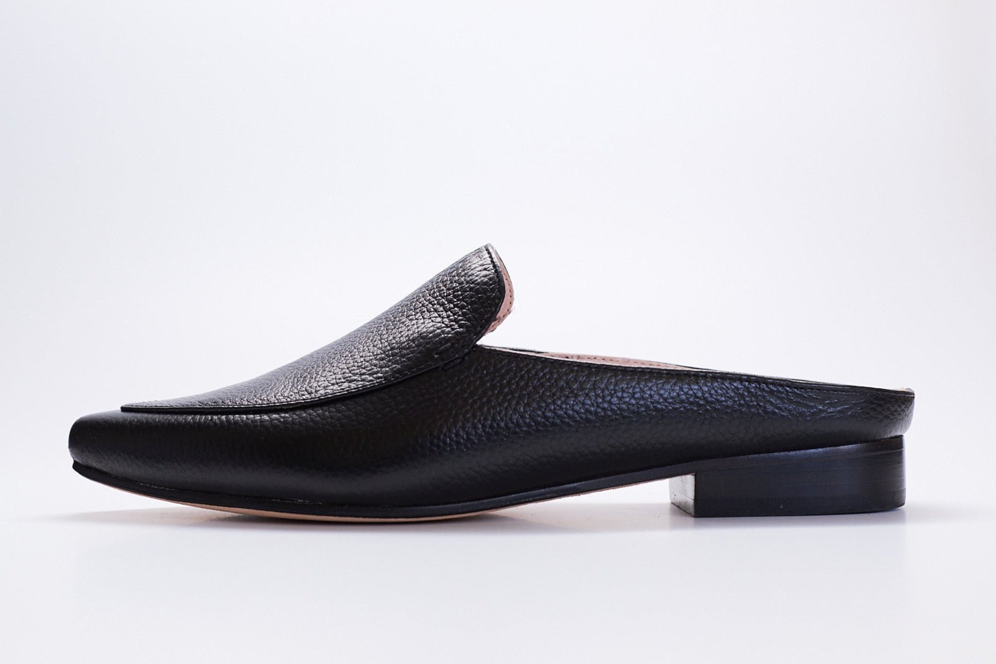 pointed toe tumbled leather slip on mules for women. all black with black heel. italian made boutique footwear.
