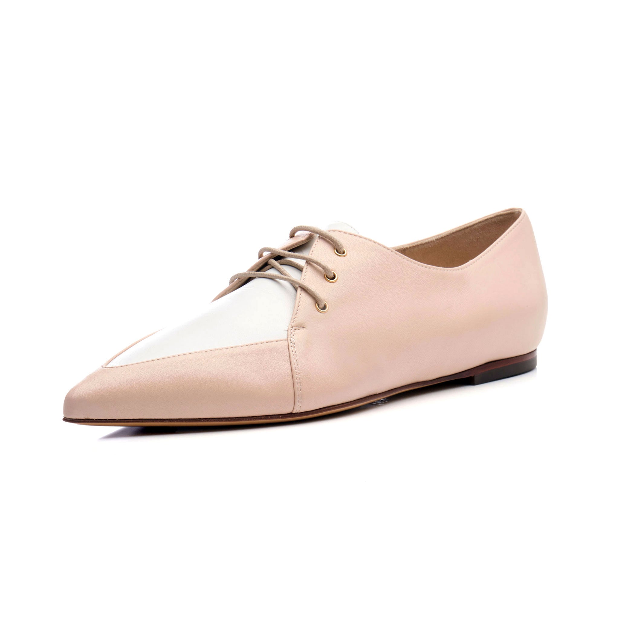 business casual spectator Oxford shoes for women made of leather in a nude blush pastel color.