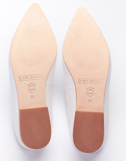 leather outsole of tumbled leather pointy loafer slides.