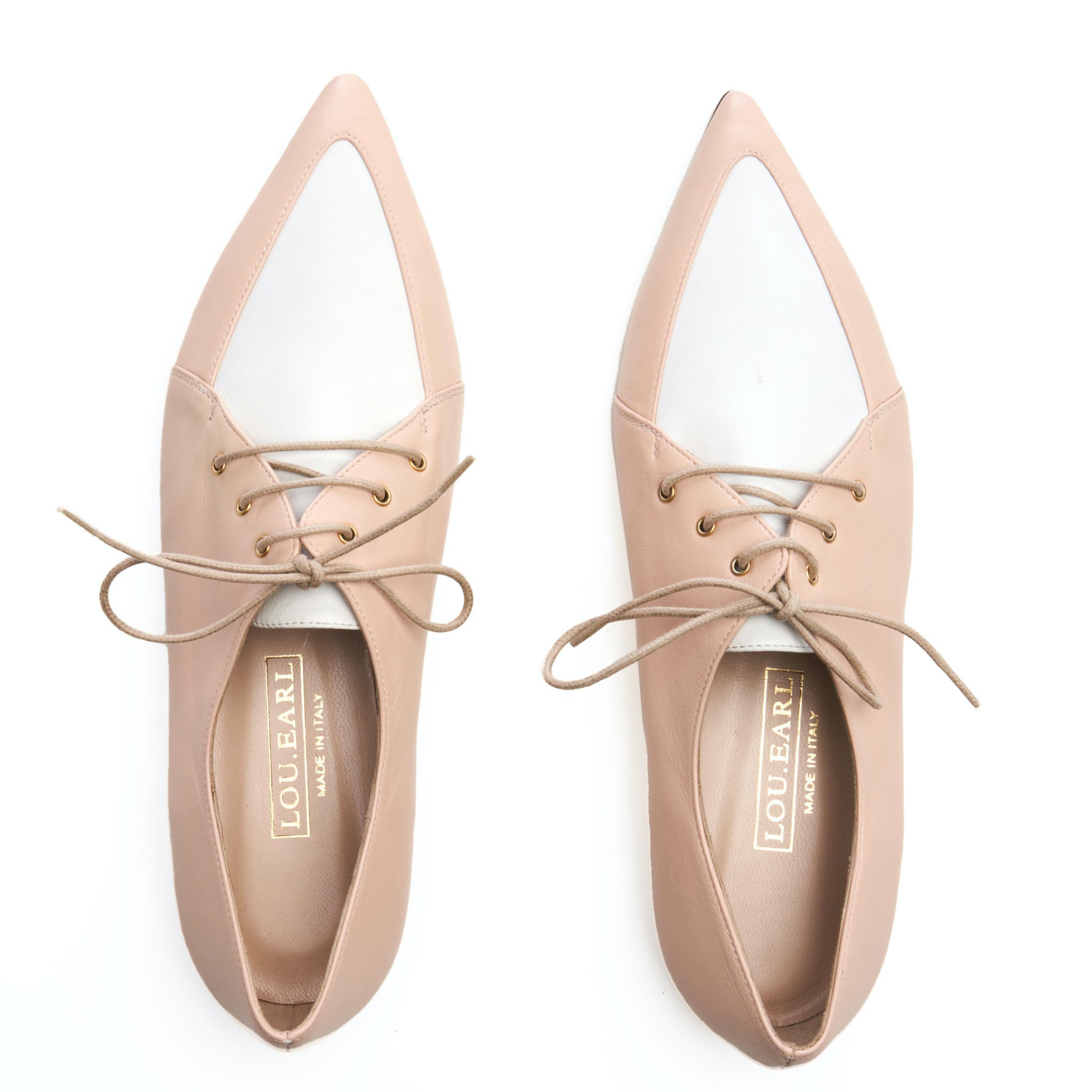 neutral blush color and white two tone lace up Oxford shoes for women with pointed toe. tan round laces and gold foil logo.