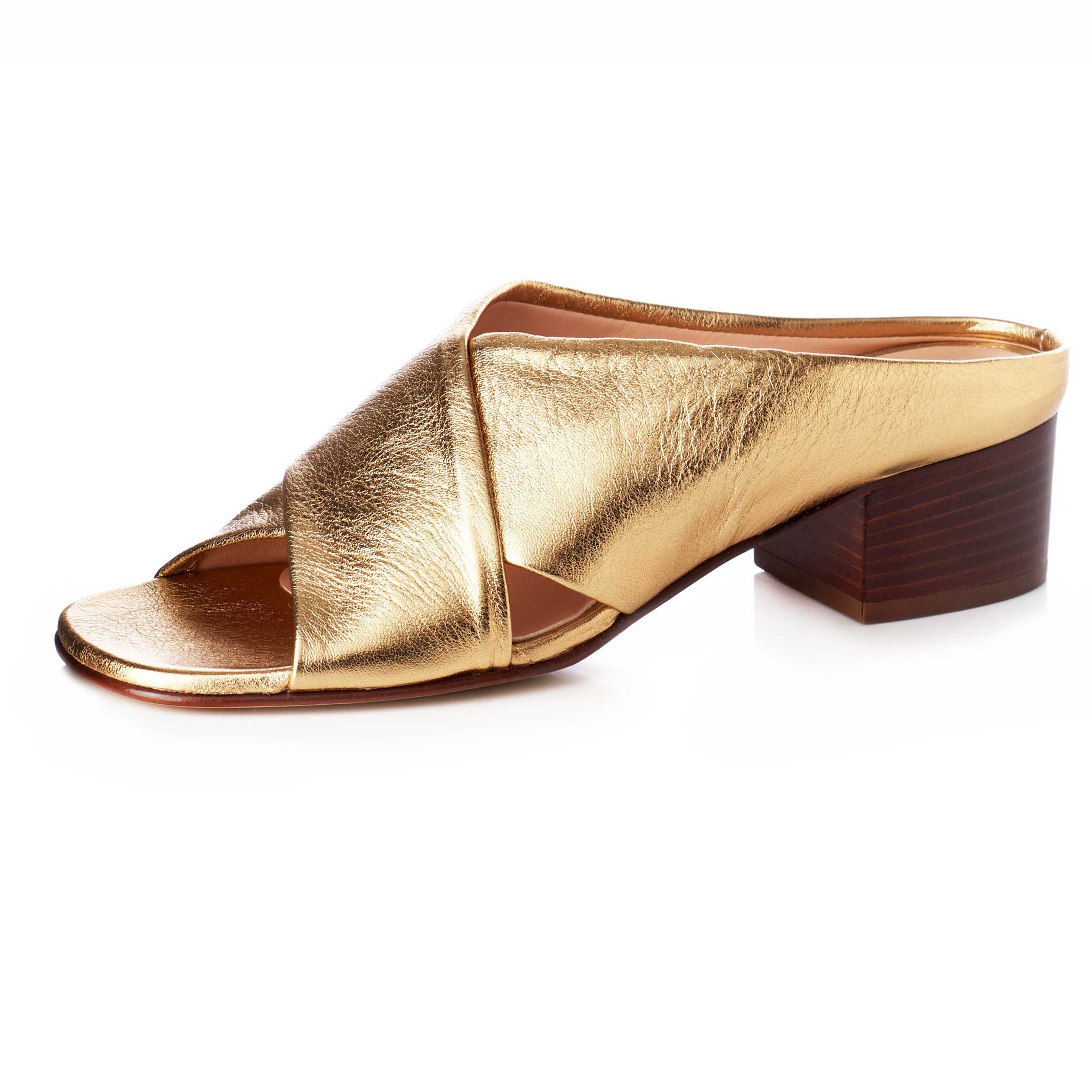 gold bronze soft crinkle leather italian heels plain with straps that cross over foot. two inch stacked wood heel.