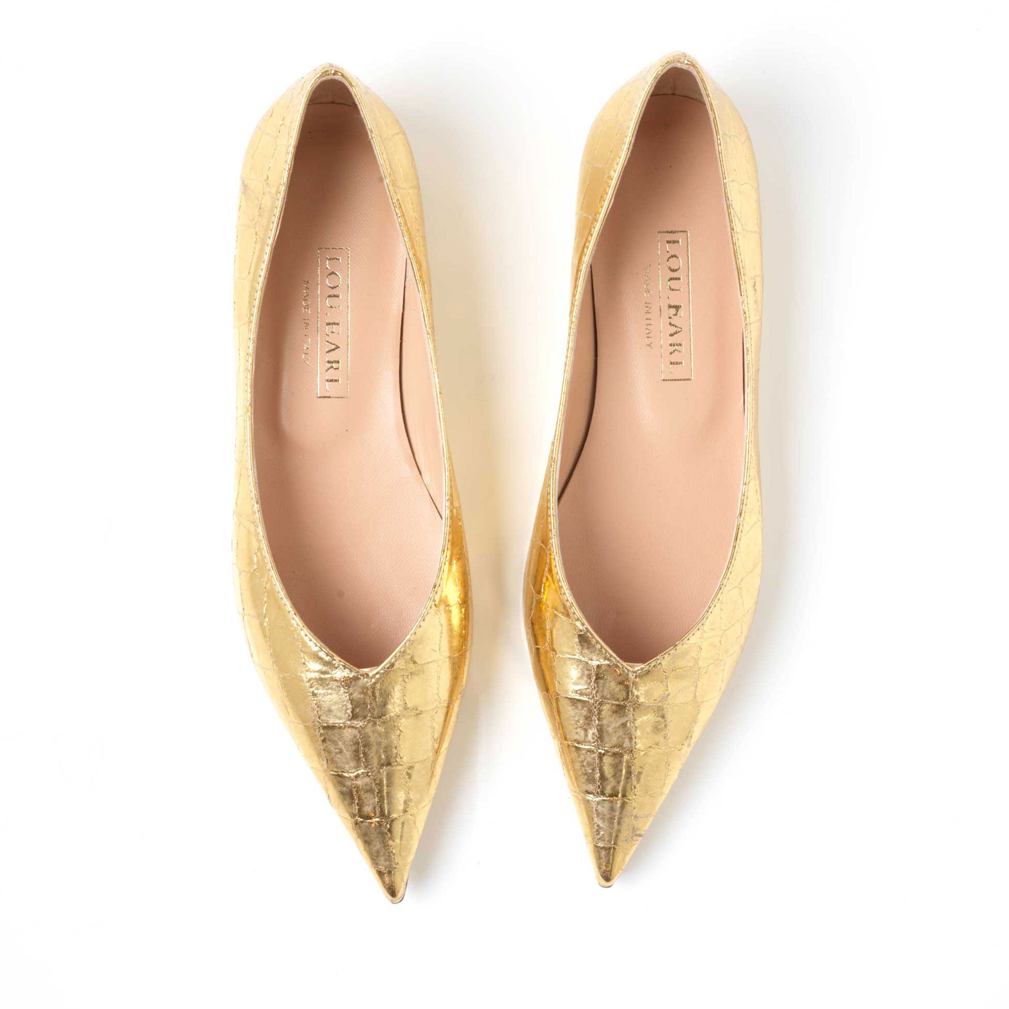 slip on gold shoes with a super pointed toe